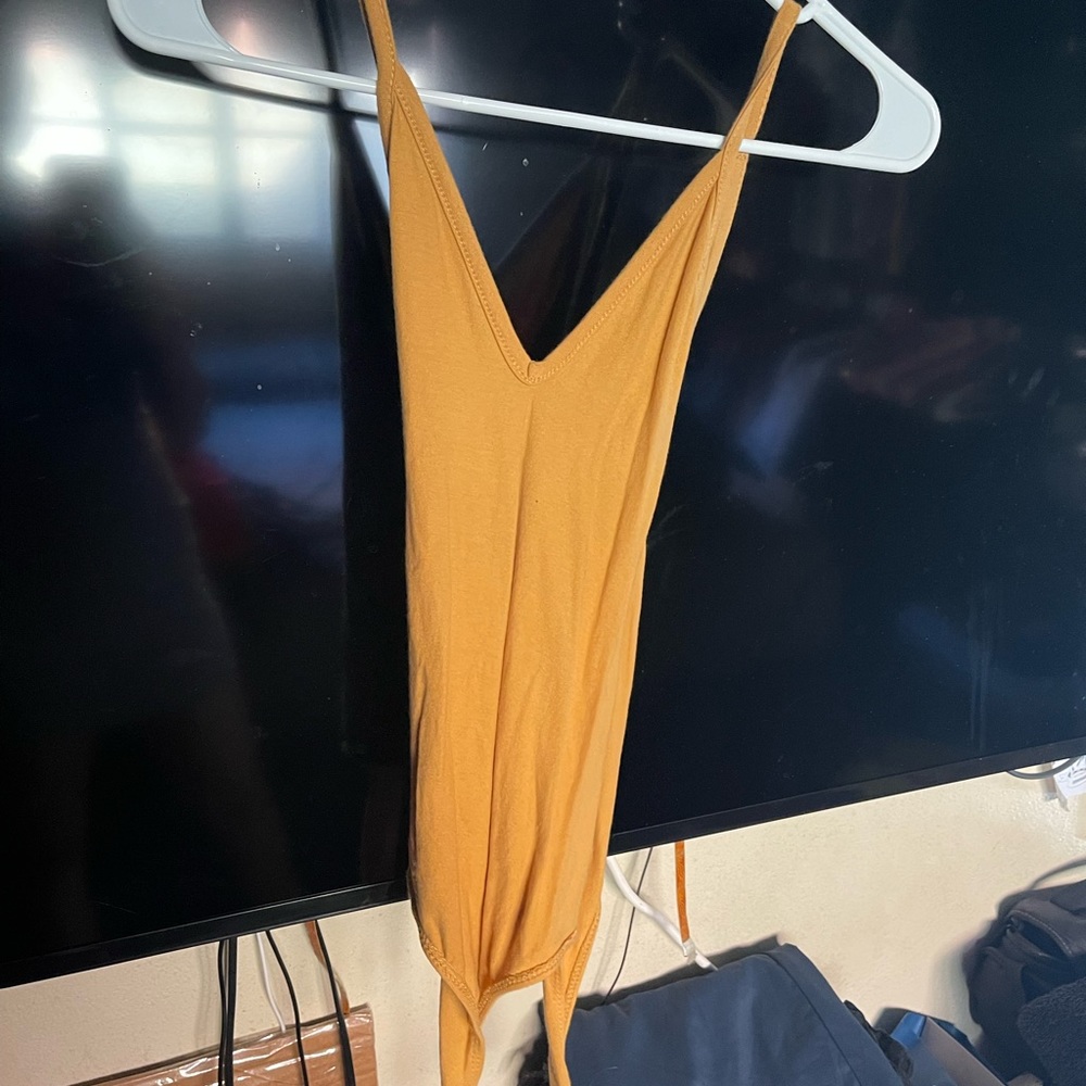 Yellow cross-back bodysuit